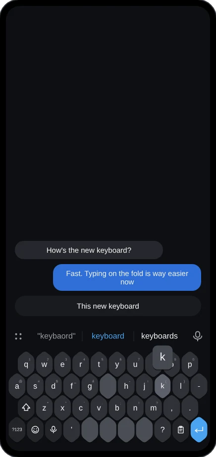 Folded keyboard while typing, with a key preview and autocorrect suggestion
